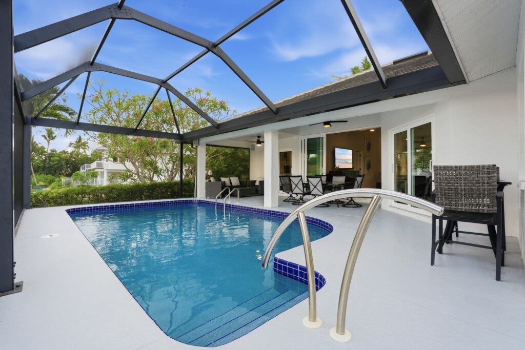 Screened private pool and covered lanai for relaxing indoor-outdoor living at Tigertail Beach Villa, Marco Island FL
