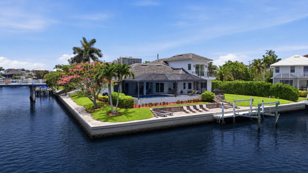 Corner-lot waterfront retreat with private dock and tropical grounds at Tigertail Beach Villa, Marco Island FL