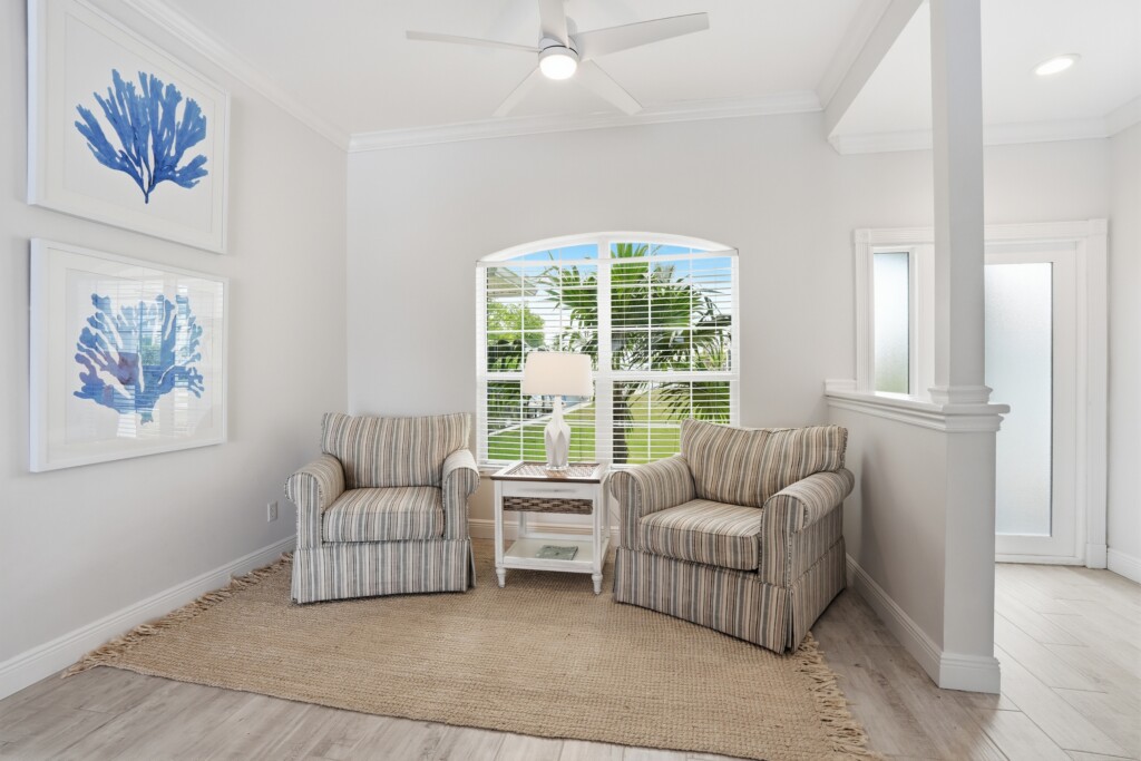 Bright coastal sitting nook with tropical views and natural light at Tigertail Beach Villa, Marco Island FL
