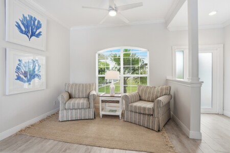 Bright coastal sitting nook with tropical views and natural light at Tigertail Beach Villa, Marco Island FL
