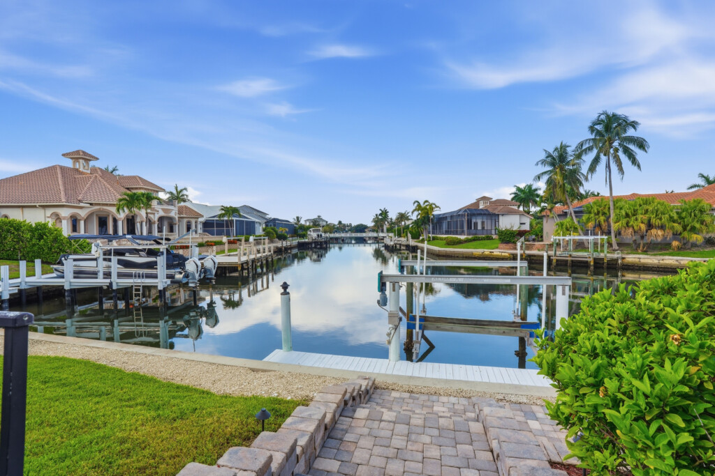 Private dock with peaceful canal views and luxury waterfront surroundings at Tigertail Beach Villa, Marco Island FL