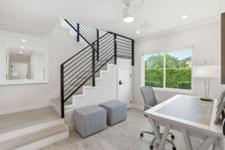 Bright modern workspace with natural light and sleek staircase design at Tigertail Beach Villa, Marco Island FL