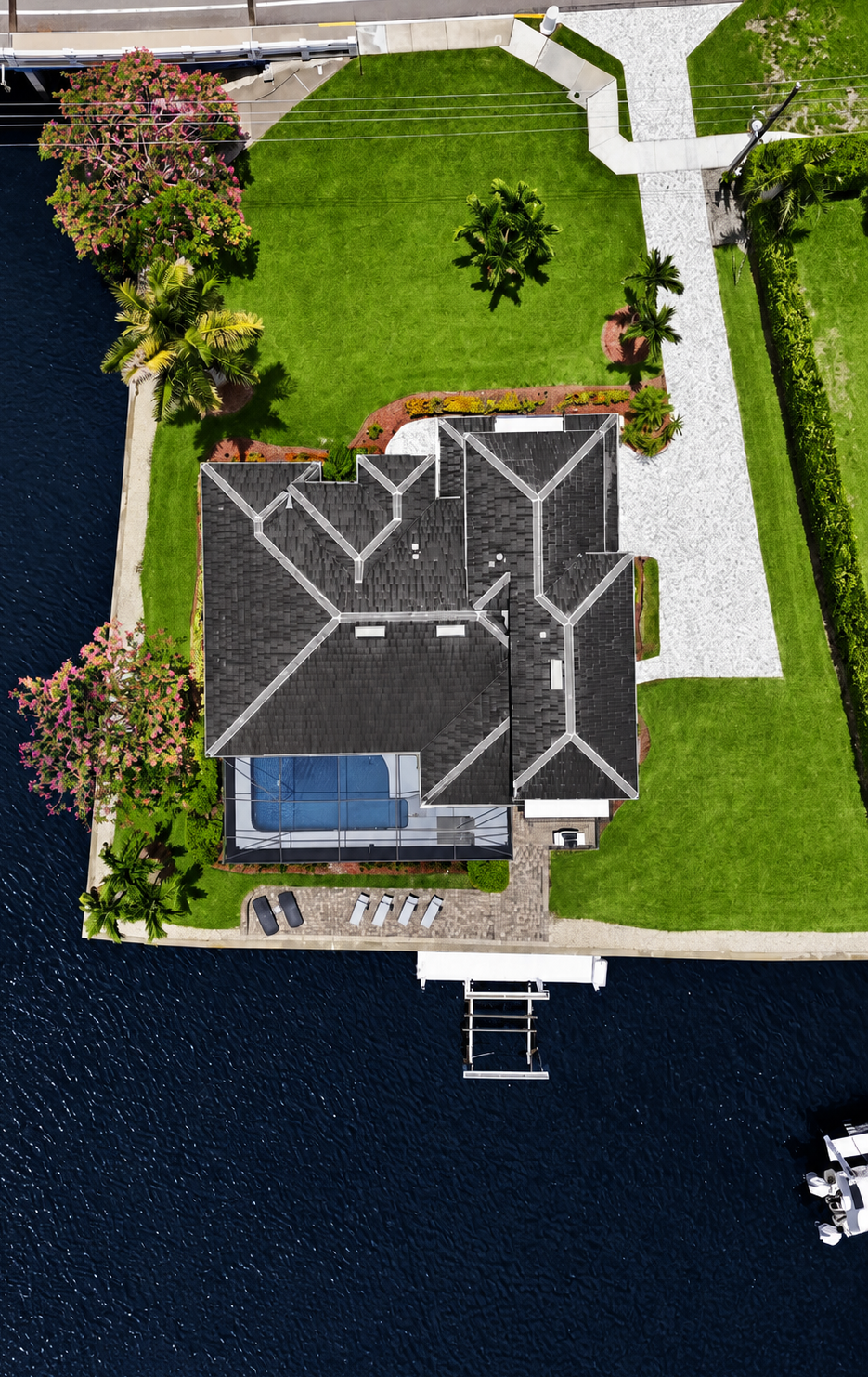 Waterfront retreat with private dock, pool, and lush tropical grounds at Tigertail Beach Villa, Marco Island FL